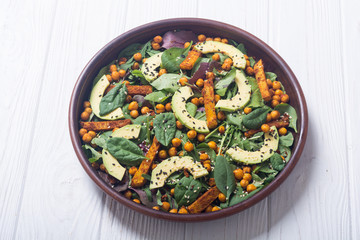 Baby spinach salad with sweet potato , chickpeas and avocado