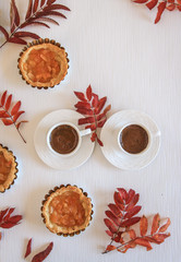 Mini apple cakes with cup of coffee. Enjoy autumn, colors. Keep memories of this autumn. Decorate leafs
