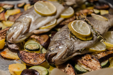 Baken trout with lemon on bed of potatoes