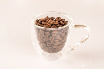 glass cup of espresso coffee and beans