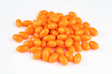 orange pills isolated on white background