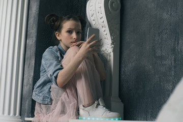 young sad vulnerable girl using mobile phone scared and desperate suffering online abuse cyberbullying being stalked and harassed in teenager cyber bullying concept