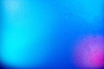 Light blue background with pink and blue spots