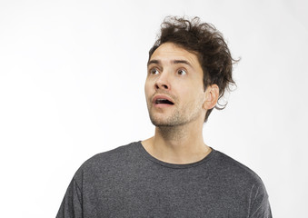 Fototapeta premium Portrait of young man with shocked facial expression