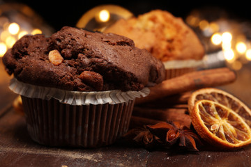 Chocolate muffin and nut muffin, homemade bakery on dark background.