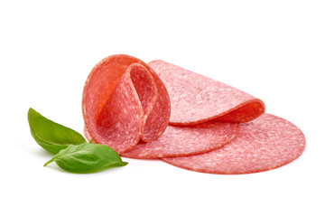 French salami with basil leaves. Isolated on white background. Close-up.