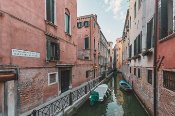 Obraz na płótnie Canvas Venetian buildings by canal in Venice, Italy