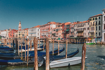 Fototapeta na wymiar Gondolas and Venetian houses by the Grand Canal of Venice, Italy