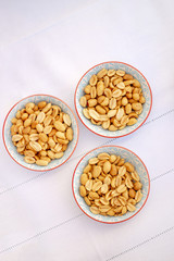 bowls of salty peanuts