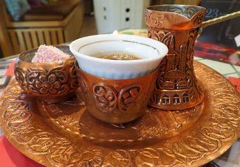 Beautiful Set of Hot Bosnian Coffee with a Long Neck Small Pot or Dzezva and Some Sweets 