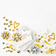 Christmas decorations and gifts in gold colors on white background with empty copy space for text. Holiday and celebration. Flat lay, top view