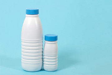 full plastic bottles of milk