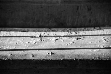 Fototapeta premium Contrast monochrome photograph of a stair tread with hard light