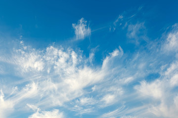 Background of transparent white clouds in a light blue sky