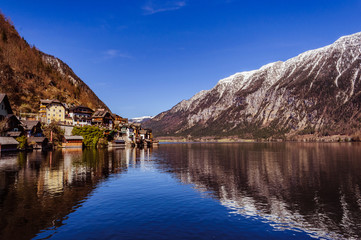 Fototapeta na wymiar Spectacular view on Hallstatt village reflecting in mountain lake