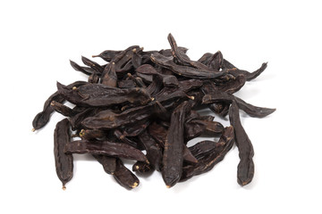 pile of carob fruits