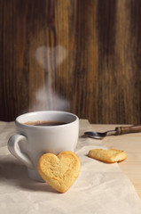 Cookies in the shape of a heart and coffee