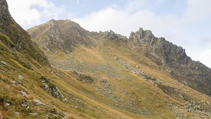 Fototapeta na wymiar Mountain peaks and trails in summer time. Romania