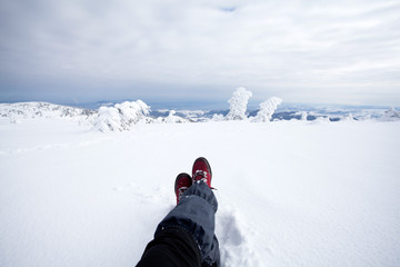 Fototapeta na wymiar Traveler in winter mountains