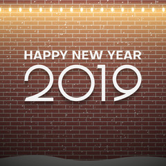 Christmas lights decorations on brown brick wall background. New Year 2019 concept