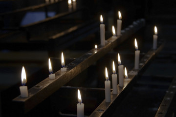 Lighted candles in a dark