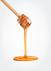 Honey flowing, dripping from wooden dipper stick.