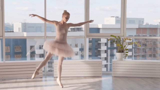 classical dance on pointe. Blond woman whirls in dance. HD slowmotion