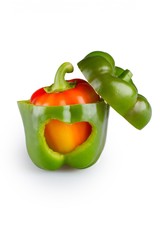 Orange bell pepper inside green bell pepper with heart shape