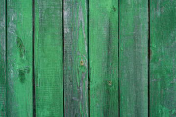 Wooden green background, stained with age and some paint peeling off