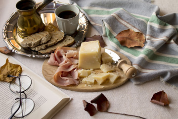 Autumn brunch with coffee, parmesan cheese, ham and toasts