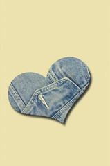 Jeans Heart on beige Background / jeans heart  on beige background, close up, vertical
