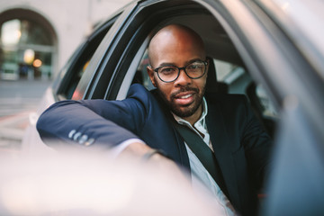 African businessman enjoying the driving car
