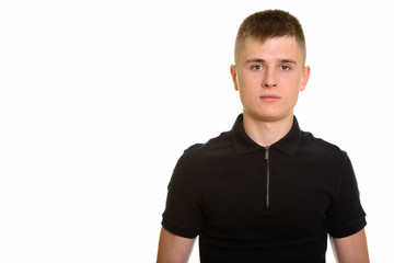 Obraz premium Young Caucasian man standing against white background