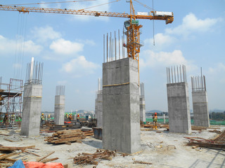 Cast column with protruding reinforcement bar. Ready for next cast for next level. Under...