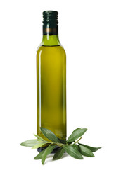 Glass bottle of oil and olive leaves on white background