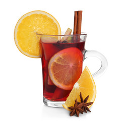 Cup with red mulled wine on white background