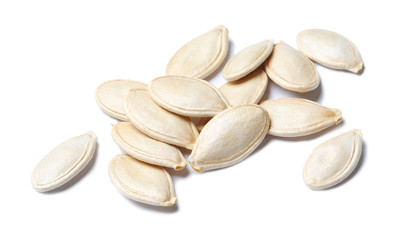 Pile of raw pumpkin seeds on white background
