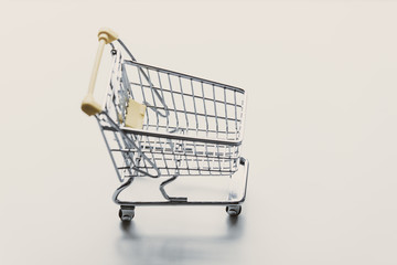 Self-service supermarket shopping little trolley cart on white background