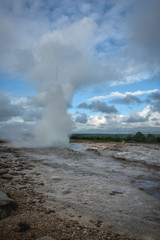 Eruption of Strokkur geyser in Iceland in summer -close-up