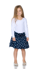 Fashionable little girl in a dress