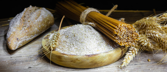 whole grain products with complex carbohydrates on rustic background