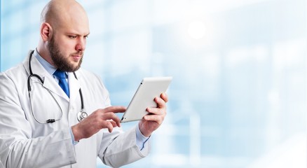 Close-up Doctor at hospital working with tablet
