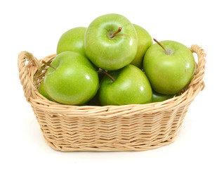 Green apples in basket on a white background