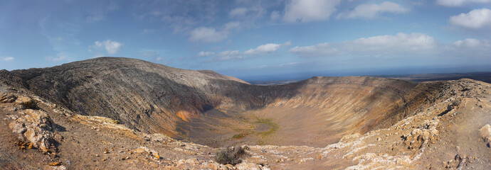 Panoramic view from the summit of a volcano crater in the island of Lanzarote, spain © sardina studio