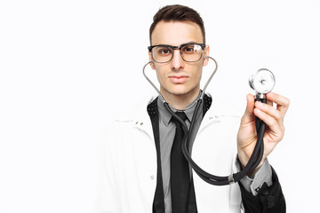 Young doctor showing a stethoscope to the survey. Close-up, hand holding a stethoscope to check breathing. isolated on white background