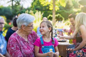  Family picnic closeup on a grandmother and her granddaughter