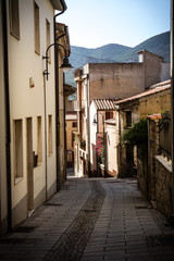Street with typical houses in the old town of Arbus, Sardinia, Ital, nobody in the scene.