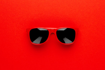 studio shot of red sunglasses. summer is coming concept