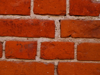 A fragment of an old brick wall.