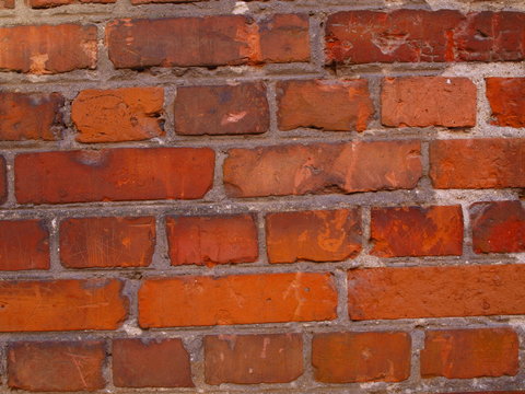 A fragment of an old brick wall.